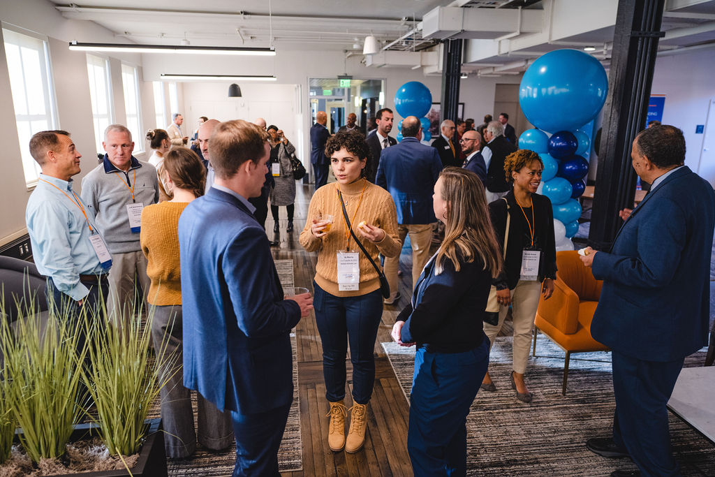 Jo Norris talks with Noah Olson and Erica Crell of Delaware Prosperity Partnership during DPP’s 2022 anniversary and investor celebration.