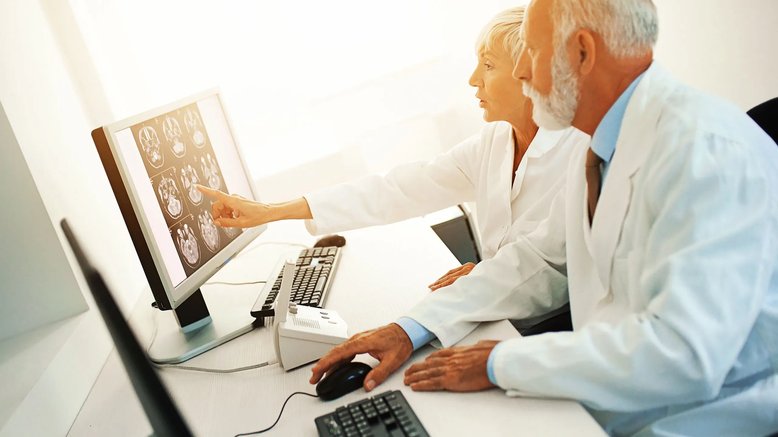 Doctors diagnosing results on the computer